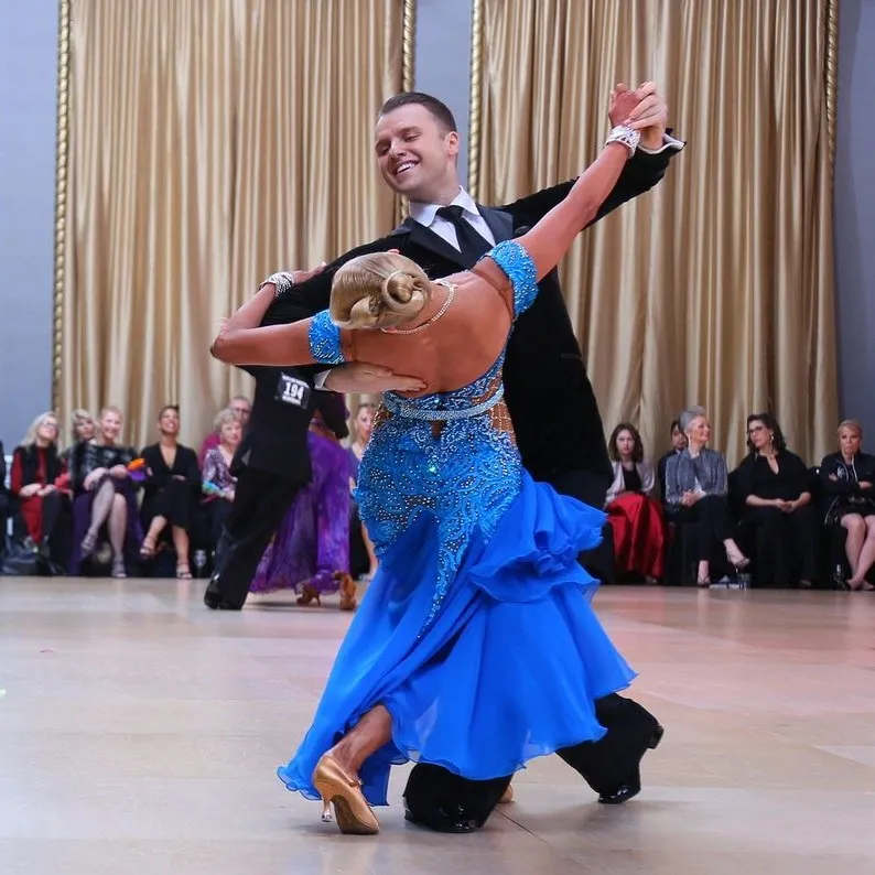Slawek and Denise dancing a graceful ballroom figure